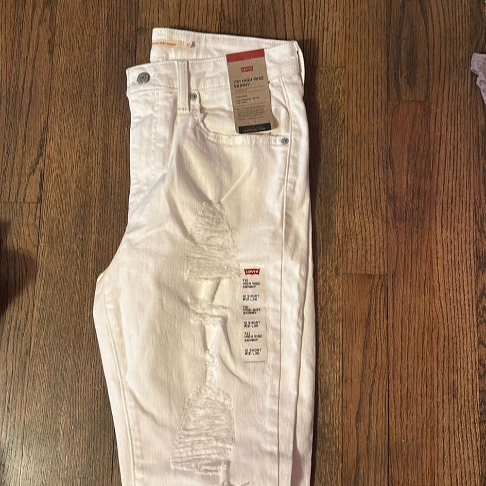 721  white ripped high rise skinny LEVIS